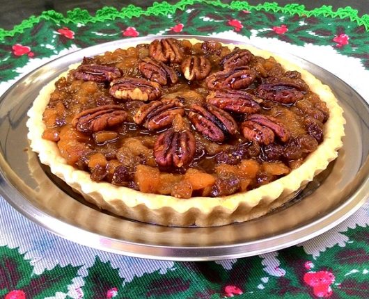 Torta natalina de figos, tâmaras e damascos com nozes pecan ao mel